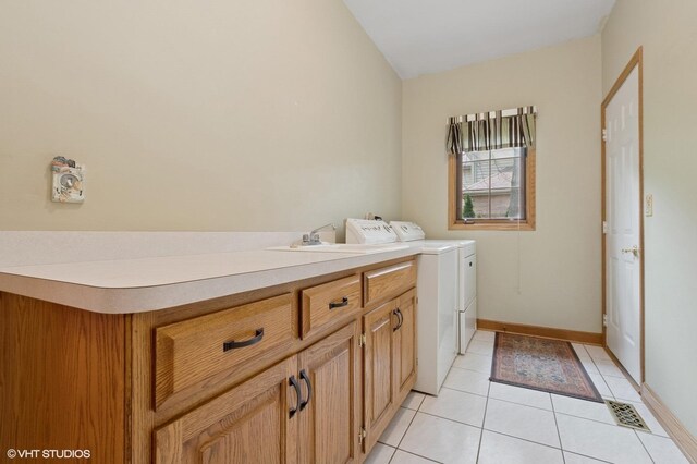 1373 Notre Dame Dr, Lemont, IL 60439 - laundry area featuring washing machine and dryer, light tile patterned flooring, cabinet space, and baseboards