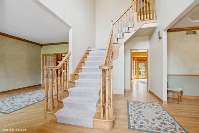 1373 Notre Dame Dr, Lemont, IL 60439 - stairs featuring wood finished floors, a towering ceiling, baseboards, and crown molding