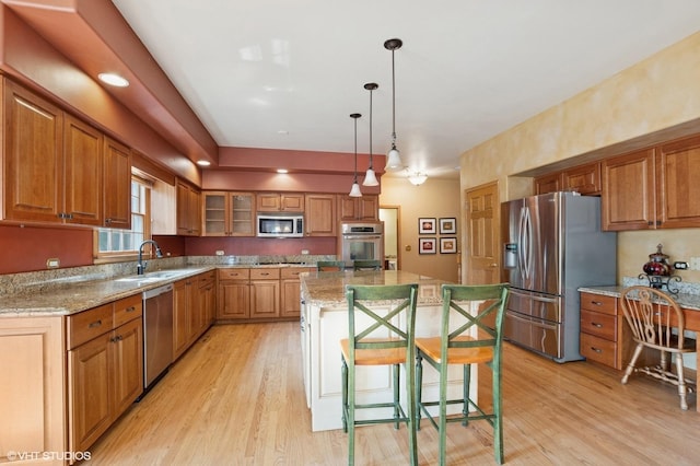 1373 Notre Dame Dr, Lemont, IL 60439 - kitchen with appliances with stainless steel finishes, a sink, and brown cabinets