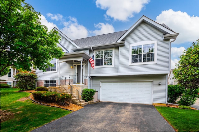 17436 Teton Cir, Lockport, IL 60441 - view of front facade with an attached garage, asphalt driveway, and a front lawn
