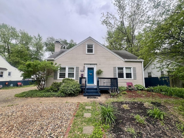 1013 W Springfield Ave, Champaign, IL 61821 - bungalow featuring a chimney, fence, and a wooden deck