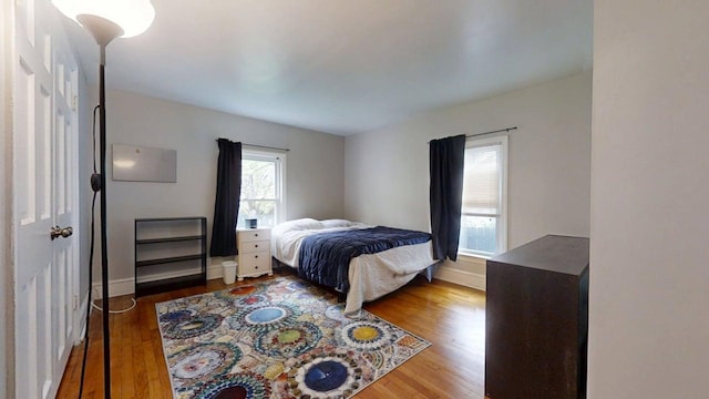 1013 W Springfield Ave, Champaign, IL 61821 - bedroom featuring wood finished floors and baseboards