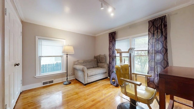 1013 W Springfield Ave, Champaign, IL 61821 - sitting room with light wood finished floors, ornamental molding, and baseboards