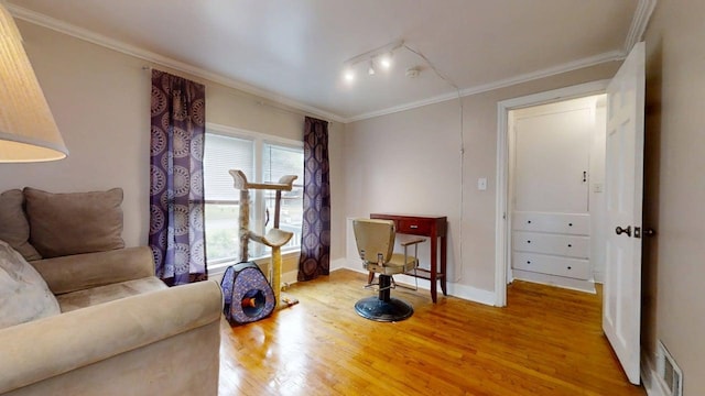 1013 W Springfield Ave, Champaign, IL 61821 - living area featuring wood finished floors, ornamental molding, and baseboards