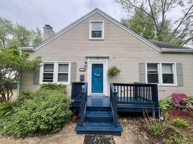 1013 W Springfield Ave, Champaign, IL 61821 - view of front of home with a chimney and a deck