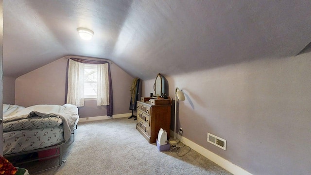 1013 W Springfield Ave, Champaign, IL 61821 - bedroom featuring baseboards, light carpet, and lofted ceiling