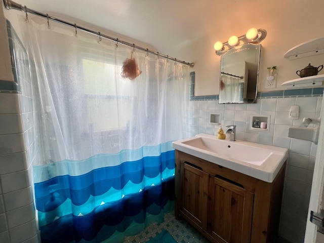 1013 W Springfield Ave, Champaign, IL 61821 - bathroom with vanity, tile walls, curtained shower, and a wainscoted wall