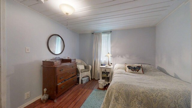 1013 W Springfield Ave, Champaign, IL 61821 - bedroom with wood finished floors, crown molding, and baseboards