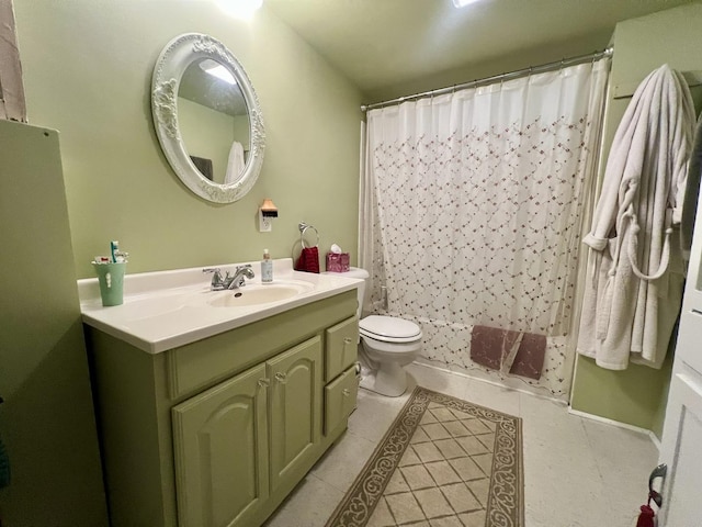 1013 W Springfield Ave, Champaign, IL 61821 - bathroom with tile patterned floors, vanity, toilet, and a shower with shower curtain