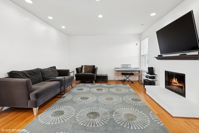 62 Andover Cir, Northbrook, IL 60062 - living area with wood finished floors, recessed lighting, and a brick fireplace