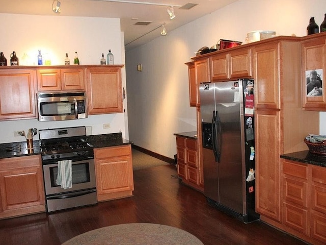 1631 N Halsted St, Chicago, IL 60614 - kitchen with stainless steel appliances, dark wood-style flooring, rail lighting, brown cabinets, and baseboards