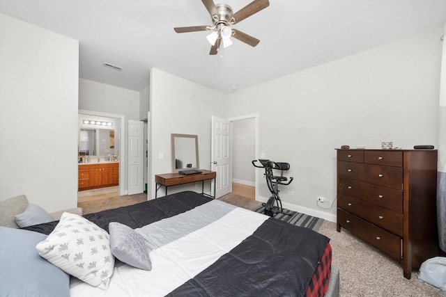 2158 N Natchez Ave Unit 1N, Chicago, IL 60707 - bedroom with a ceiling fan, baseboards, ensuite bath, visible vents, and light colored carpet