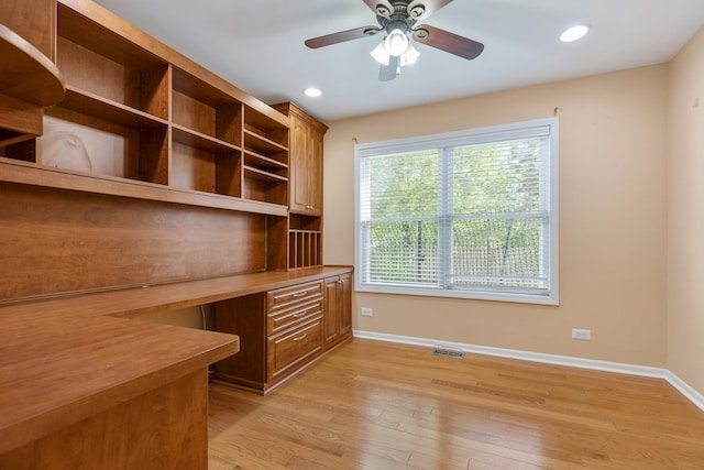 unfurnished office featuring baseboards, ceiling fan, light wood-type flooring, built in study area, and recessed lighting