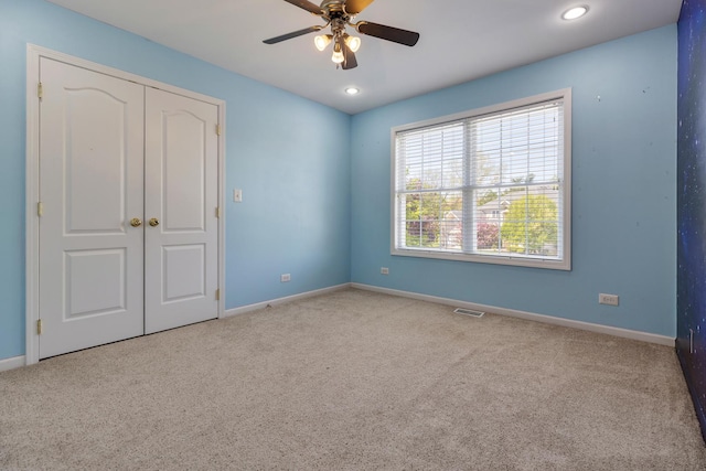 unfurnished bedroom featuring carpet, baseboards, and recessed lighting