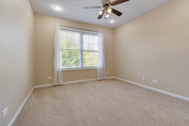 carpeted empty room featuring a ceiling fan, baseboards, and recessed lighting