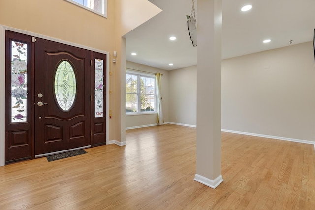 entrance foyer featuring baseboards, light wood-style flooring, and recessed lighting
