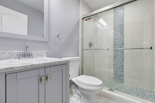 full bath with toilet, a shower stall, and vanity