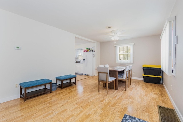 411 E 2nd St, Lockport, IL 60441 - dining room featuring light wood-type flooring, ceiling fan, and baseboards