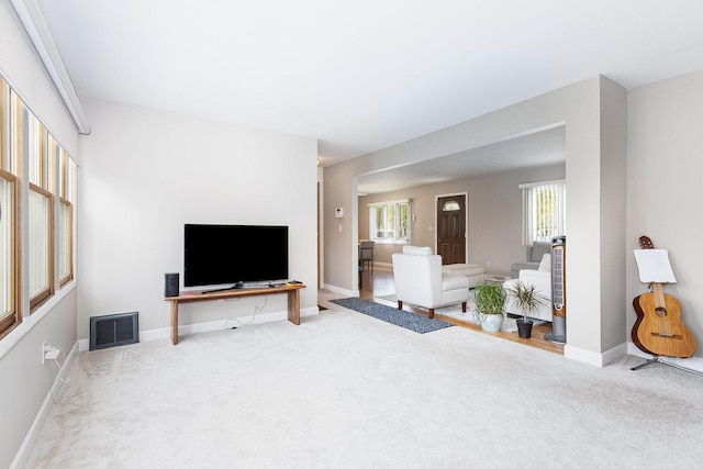 411 E 2nd St, Lockport, IL 60441 - carpeted living room featuring baseboards