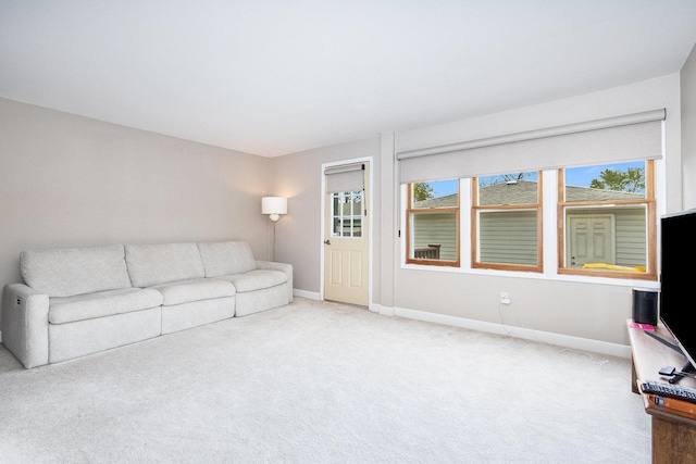 411 E 2nd St, Lockport, IL 60441 - unfurnished living room with baseboards and carpet