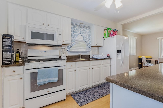 411 E 2nd St, Lockport, IL 60441 - kitchen featuring white appliances, a sink, white cabinetry, and backsplash