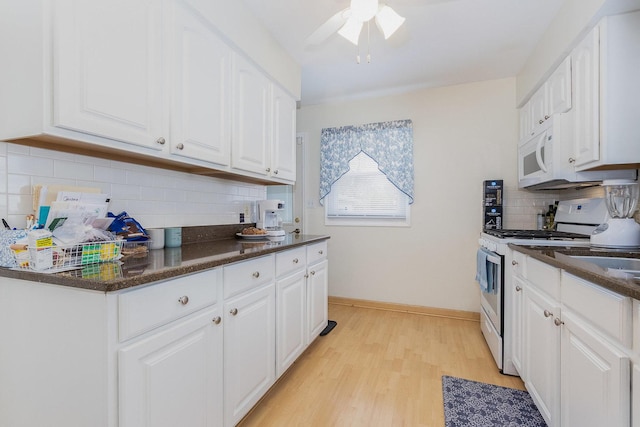 411 E 2nd St, Lockport, IL 60441 - kitchen featuring white appliances, backsplash, white cabinetry, and light wood-style floors
