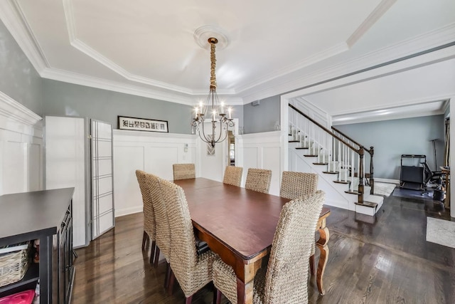 3511 Stackinghay Dr, Naperville, IL 60564 - dining space with a chandelier, dark wood finished floors, a decorative wall, stairway, and crown molding