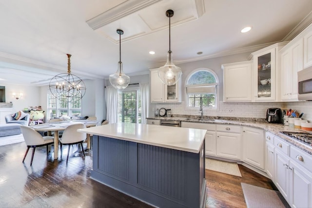 3511 Stackinghay Dr, Naperville, IL 60564 - kitchen featuring plenty of natural light, white cabinetry, dishwasher, crown molding, and backsplash