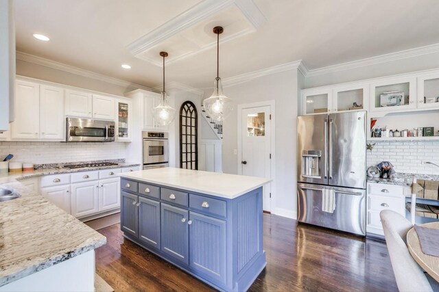 3511 Stackinghay Dr, Naperville, IL 60564 - kitchen with appliances with stainless steel finishes, white cabinetry, ornamental molding, backsplash, and decorative light fixtures