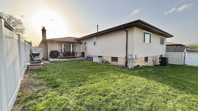 15509 Brianne Ln, Oak Forest, IL 60452 - rear view of property featuring a patio, central air condition unit, and a chimney