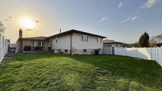 15509 Brianne Ln, Oak Forest, IL 60452 - rear view of property featuring a chimney, a shed, an outbuilding, cooling unit, and a patio