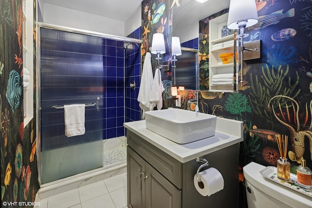 full bath featuring vanity, toilet, a shower stall, and tile patterned floors