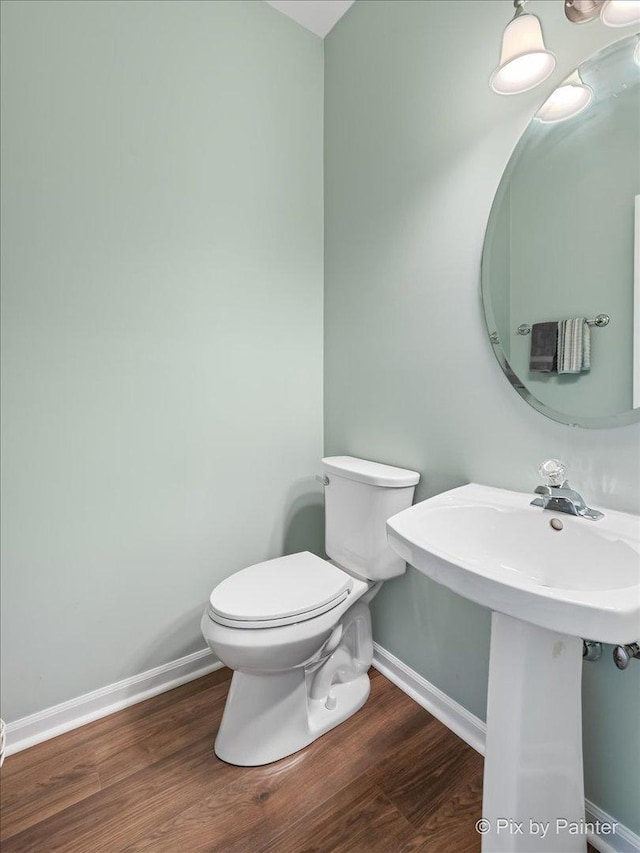 1840 Nashville Ln, Crystal Lake, IL 60014 - bathroom featuring wood finished floors, toilet, and baseboards