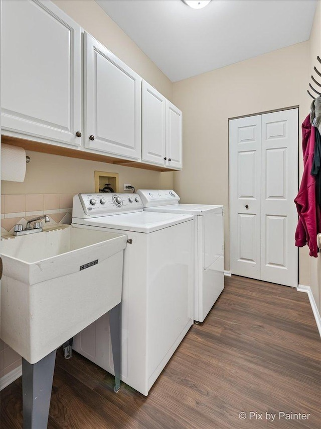 1840 Nashville Ln, Crystal Lake, IL 60014 - washroom featuring washing machine and clothes dryer, cabinet space, and dark wood-style floors
