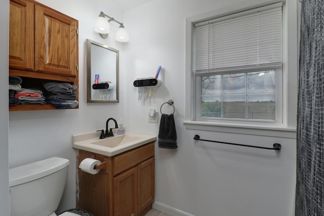 bathroom with vanity and toilet