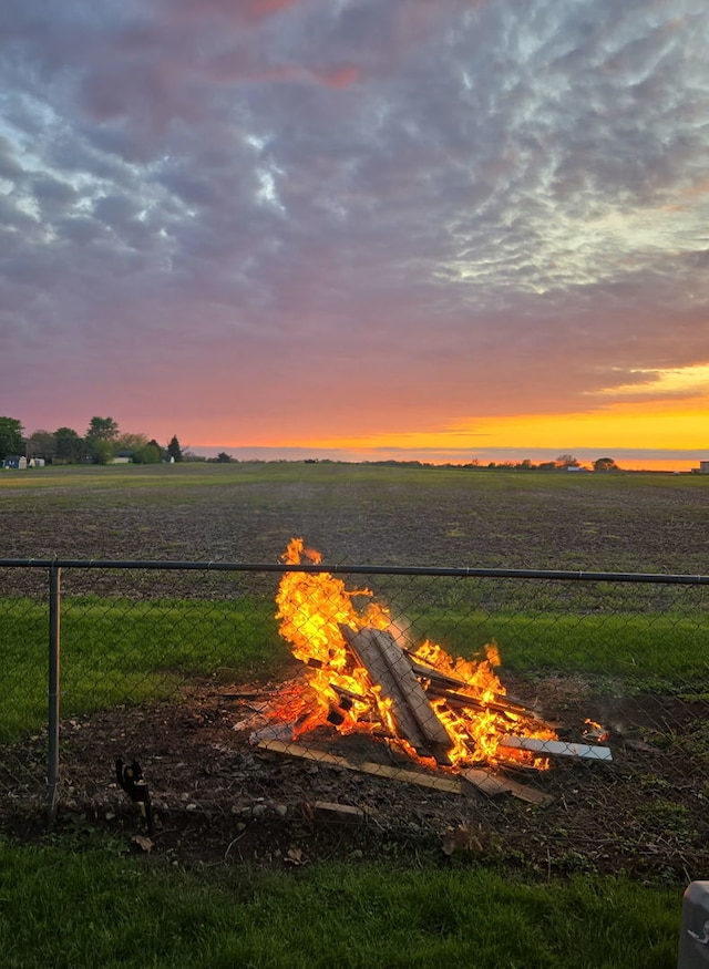 506 N Grove St, Colfax, IL 61728 - water view with an outdoor fire pit, rural landscape, and fence