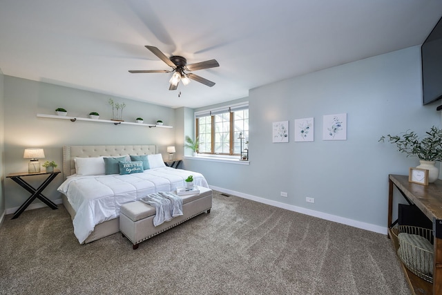 bedroom with baseboards, carpet floors, and a ceiling fan