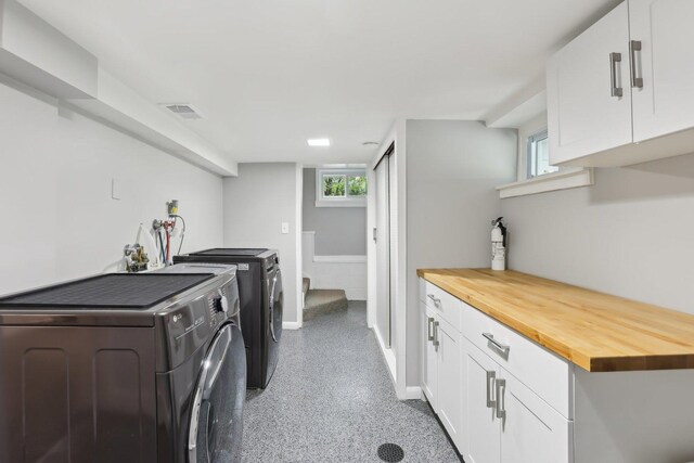 bedroom with light colored carpet and baseboards