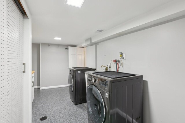 bathroom featuring wood finished floors, vanity, healthy amount of natural light, and baseboards