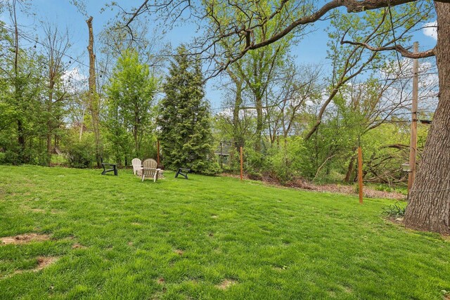 view of patio / terrace with a hot tub and a deck