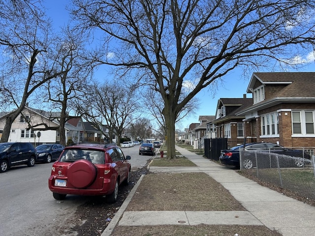 view of road featuring sidewalks and a residential view
