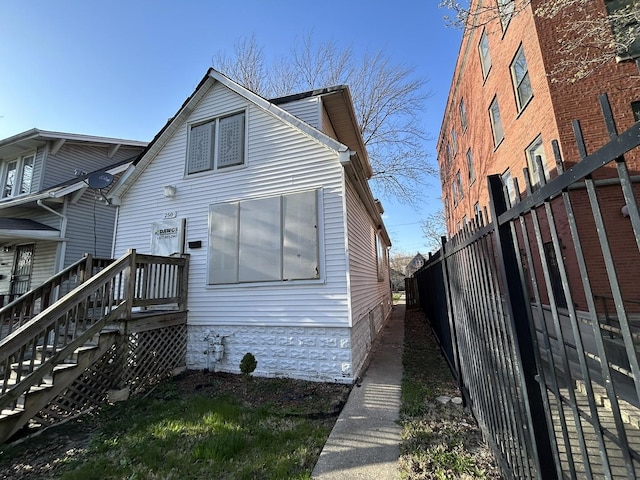 back of property with fence