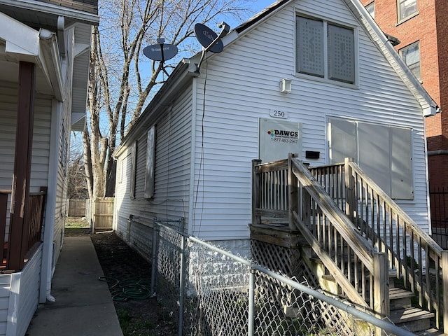 back of house with stairway and fence