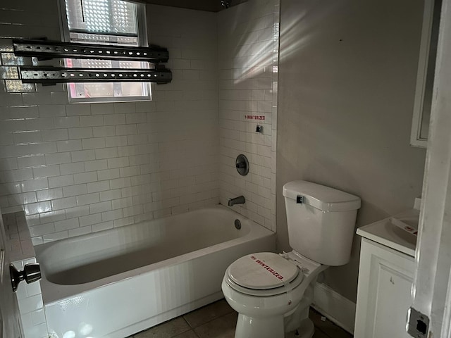 full bath featuring toilet, tile patterned floors, vanity, and bathing tub / shower combination