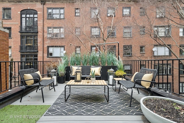 wooden deck featuring outdoor lounge area