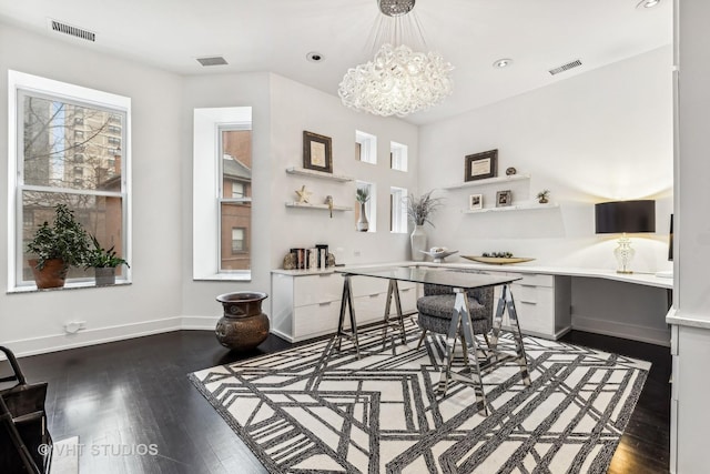 dining room featuring plenty of natural light, visible vents, and wood finished floors