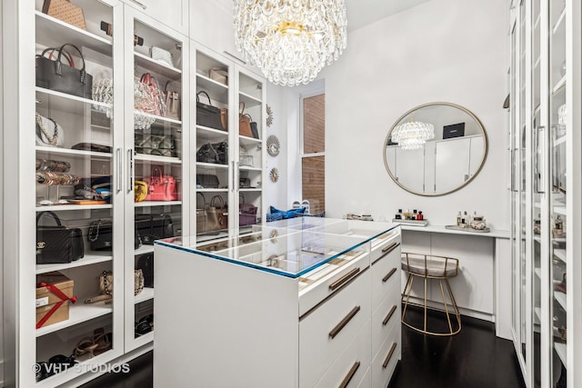 spacious closet featuring a chandelier
