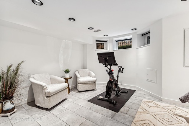 exercise area with baseboards, visible vents, and recessed lighting