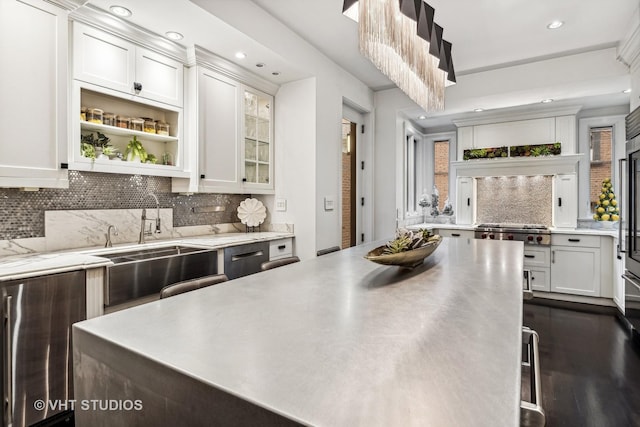 kitchen with backsplash, white cabinets, recessed lighting, and glass insert cabinets