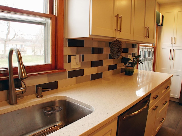 571 Dawn Cir, Grayslake, IL 60030 - kitchen featuring dishwashing machine, light stone counters, white cabinets, and a sink
